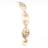 Symmetalic Sterling and 14kt Gold Blue Topaz Bracelet vintage - Rhinestone Rosie